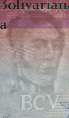 Piece bbcv100bss-aa01-b8 (Obverse, partial, in front of light)